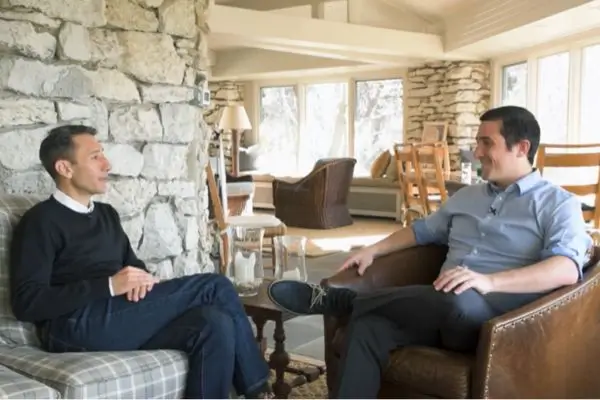 Juan Alvarez sitting with one to one coaching client